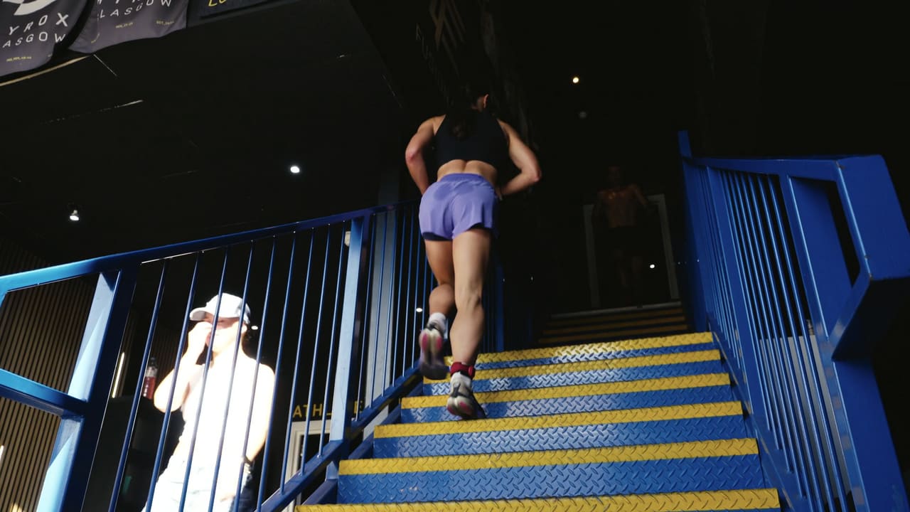 Athlete running up a stairwell on the race course